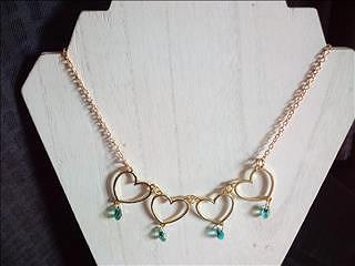 [ #W126 ] $40.00USD - Goldtone necklace with 4 golden hearts pendant each with turquoise colored gla(..)